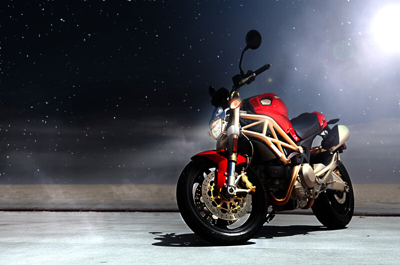 Red Motorcycle on Pavement — Dramatic, Night