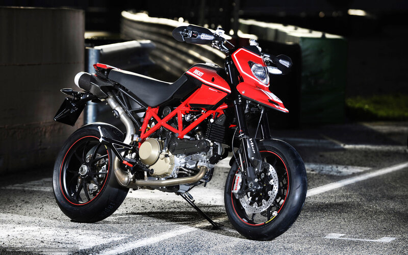 Red Motorcycle on Pavement — Dramatic