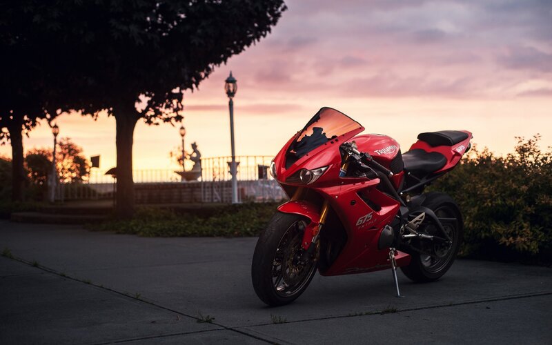 Red Motorcycle on Pavement — Serene