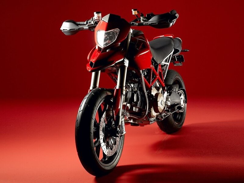 Red motorcycle on red background