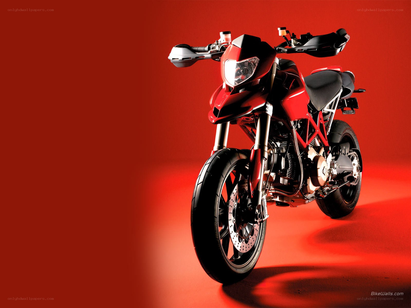 red motorcycle on red background