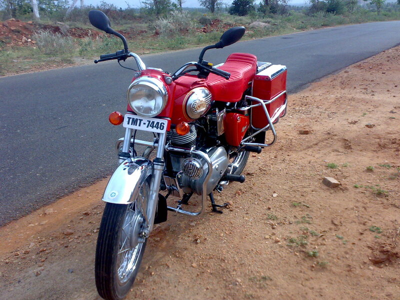 Red motorcycle on roadside