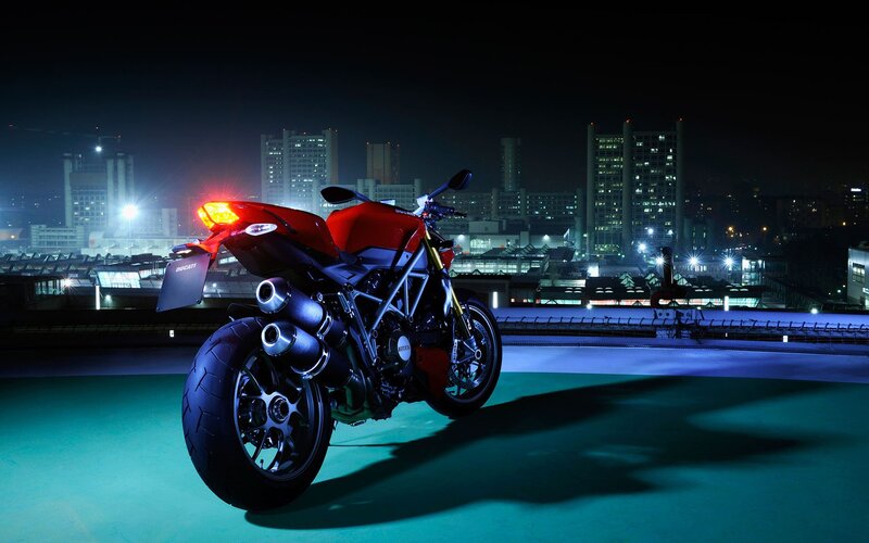 Red Motorcycle on Rooftop — Dramatic