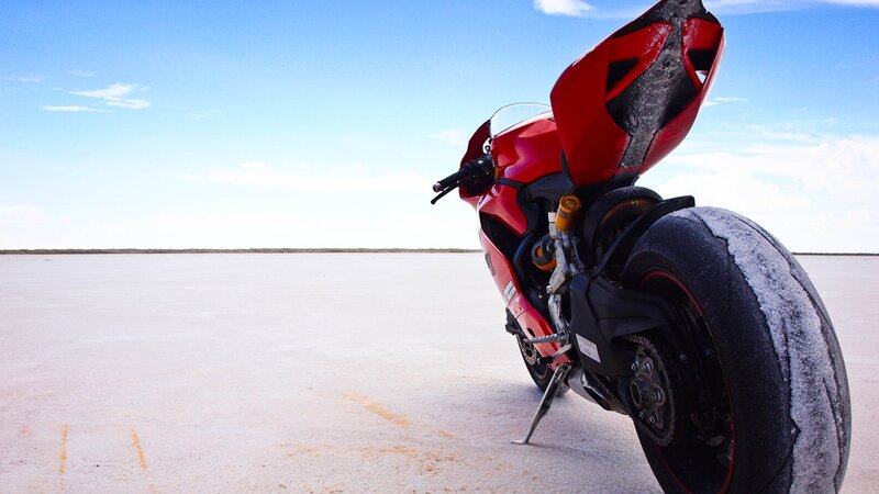 Red motorcycle on salt flat