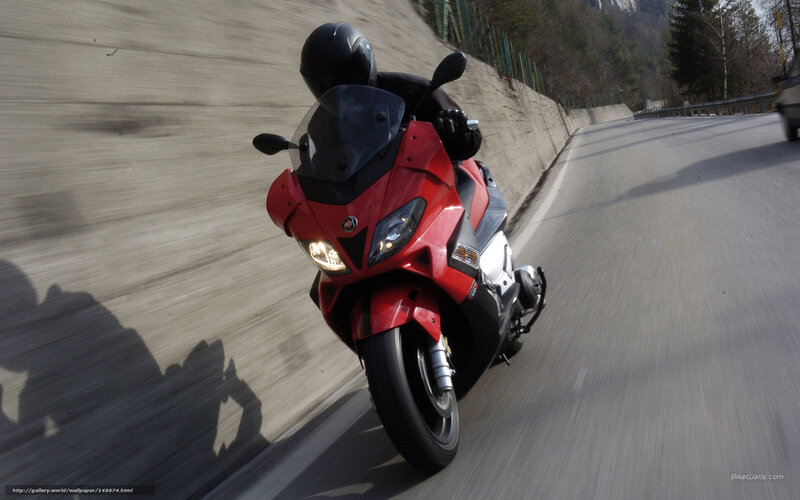 red motorcycle on winding road