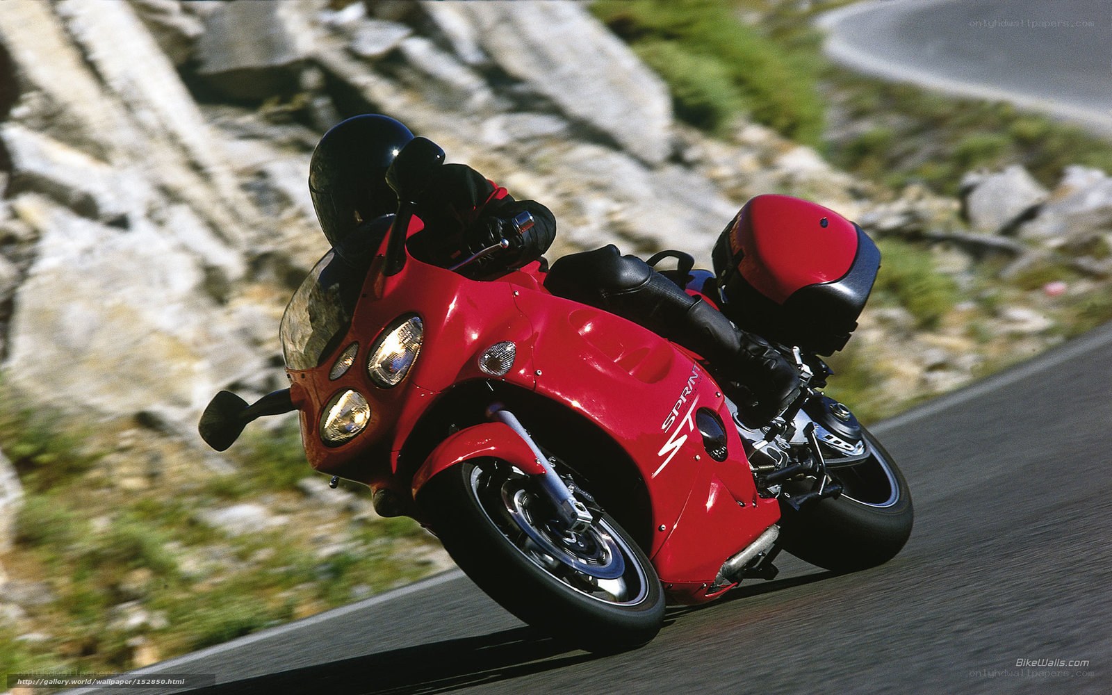 Red motorcycle on winding road