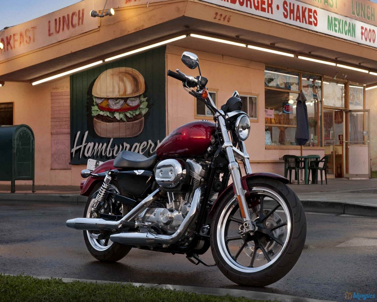 Red motorcycle outside diner