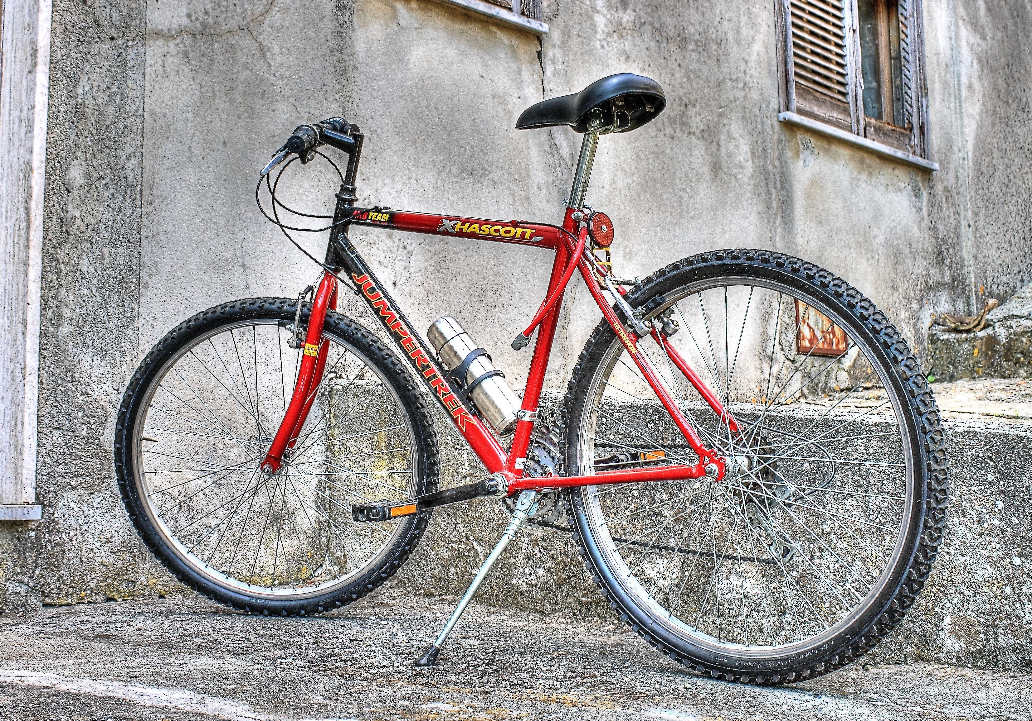 red mountain bike on street