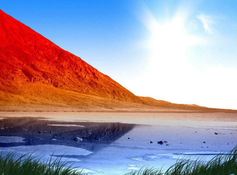 Red mountain by lake