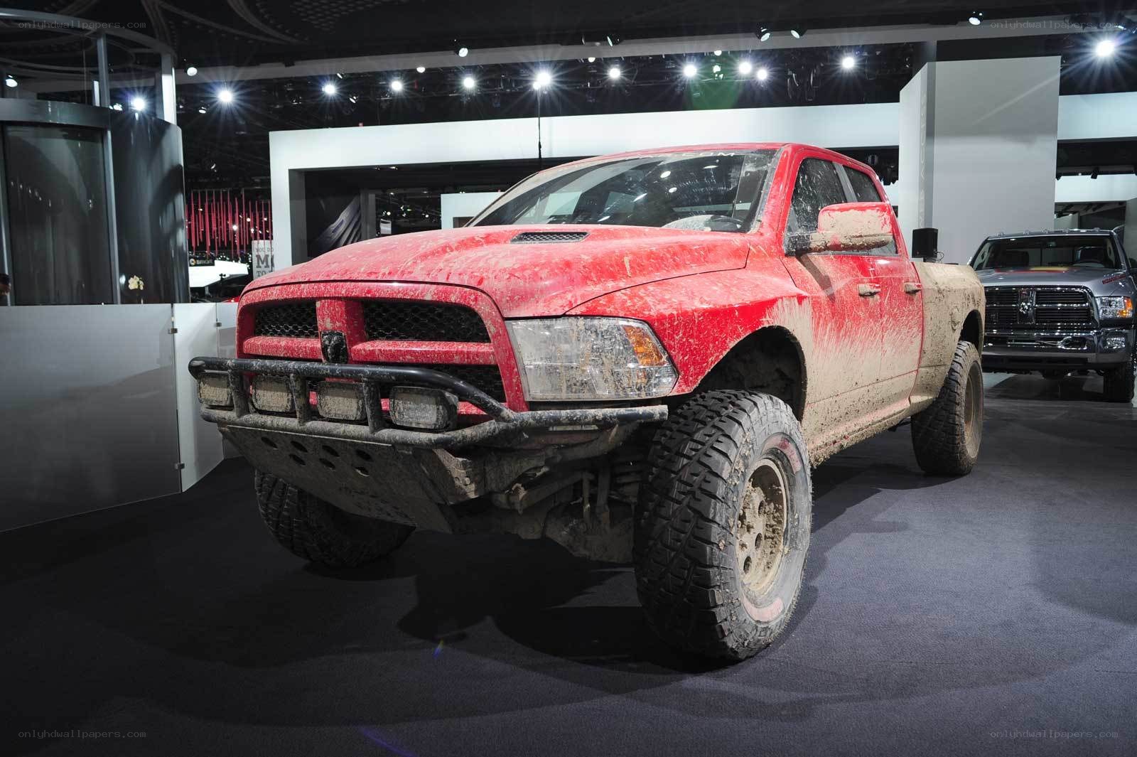 Red mud-splattered pickup truck