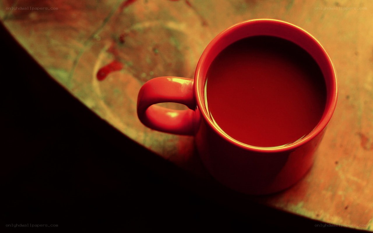 red mug on wooden table