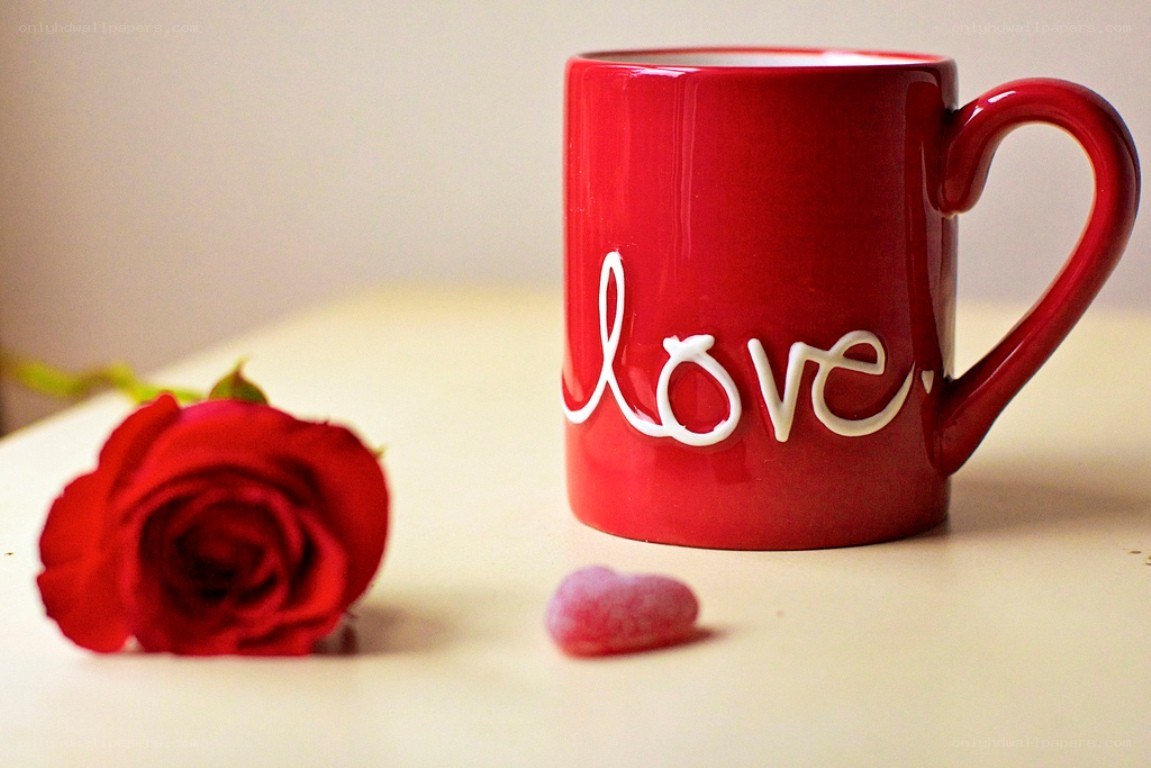 Red mug with rose and candy