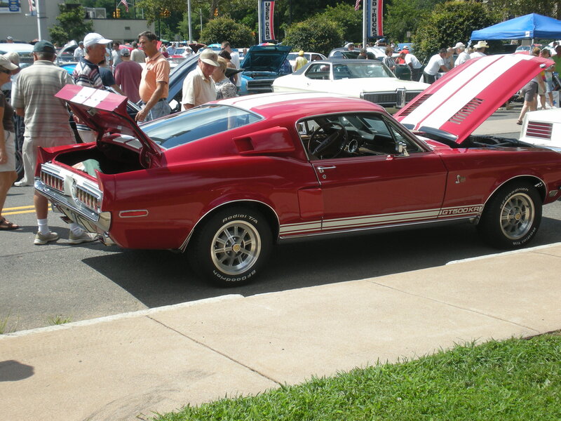 Red muscle car at a car show
