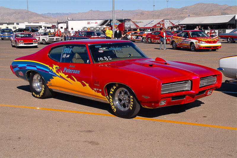 Red muscle car at a race event