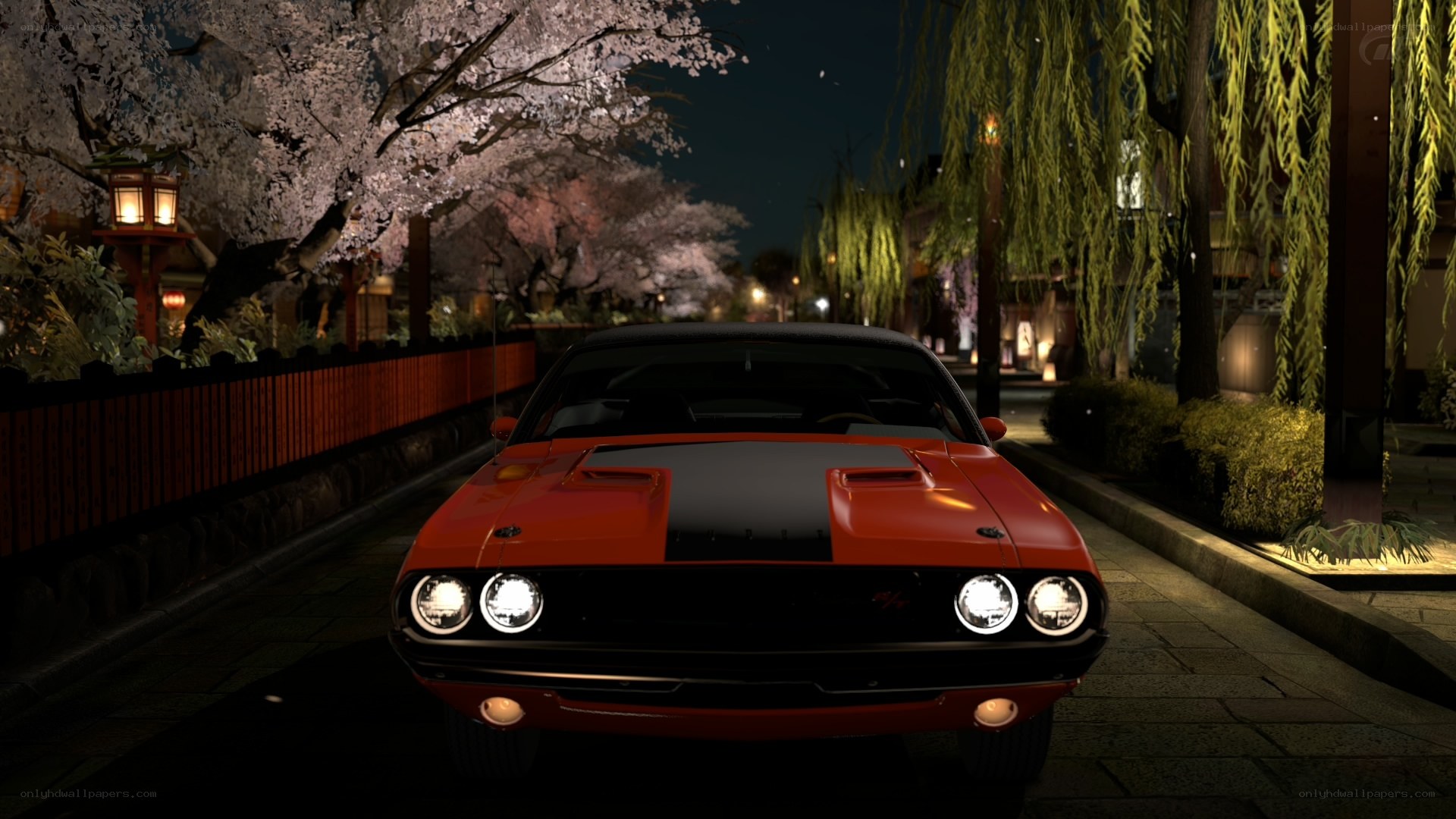 Red muscle car at night