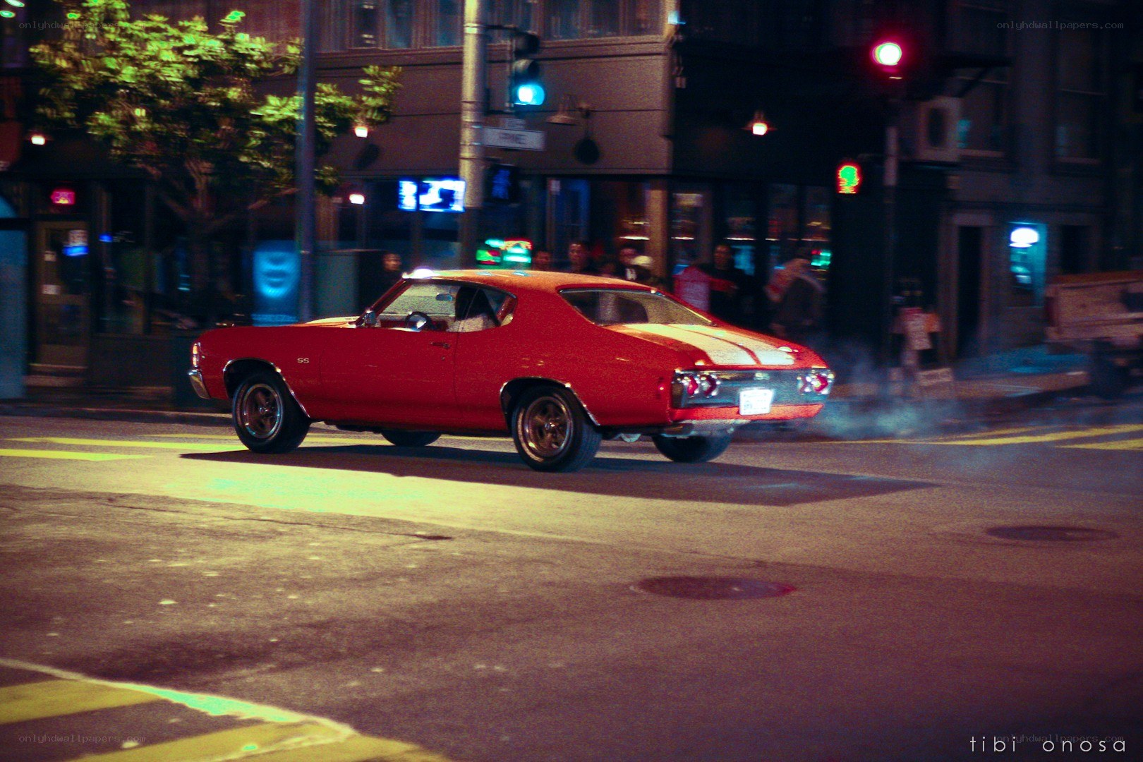 red muscle car at night