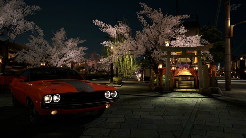 Red muscle car at night