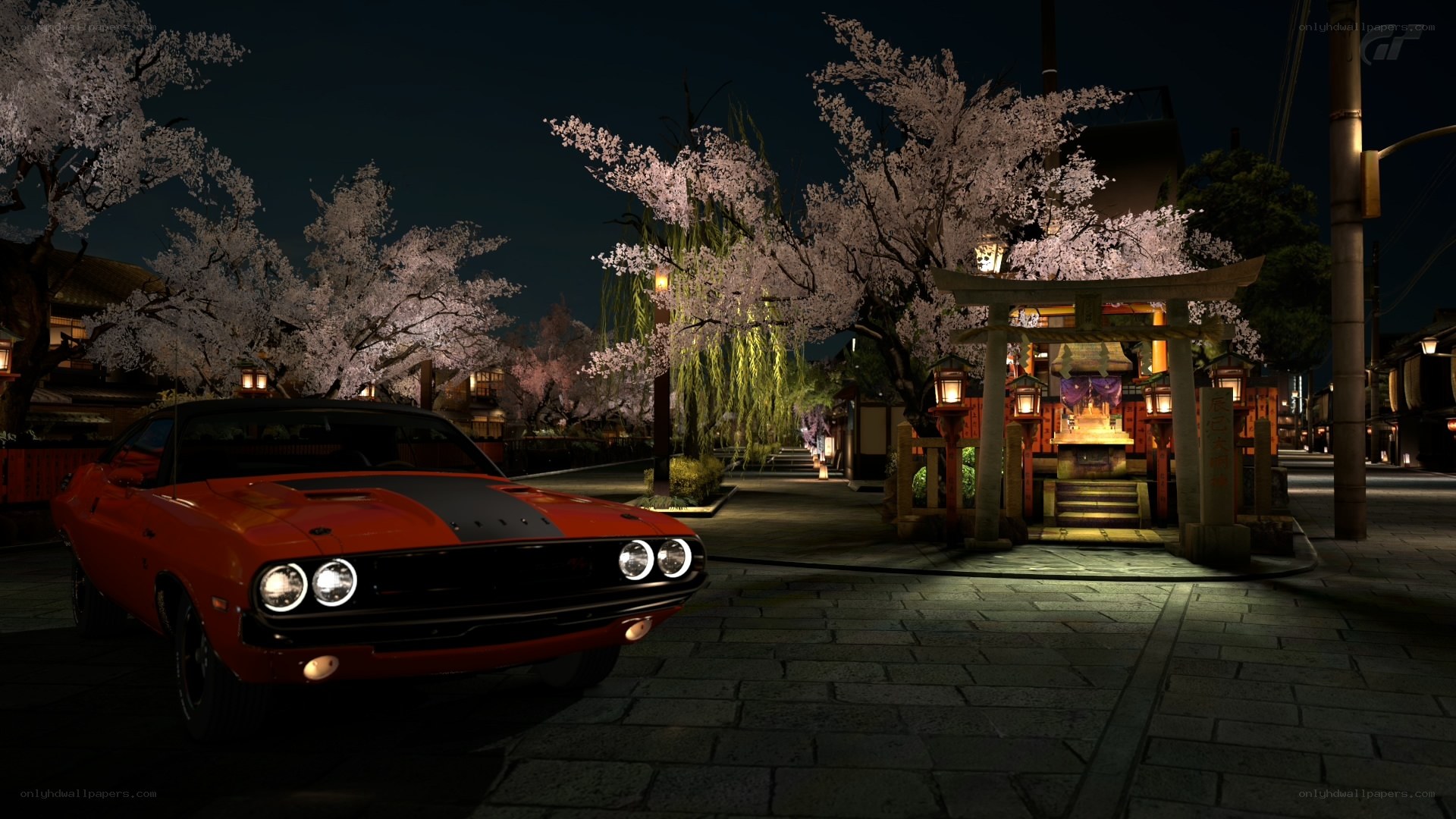 Red muscle car at night