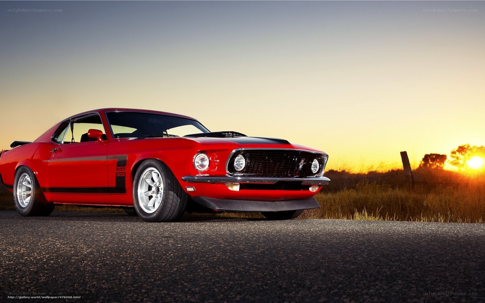 Red muscle car at sunset