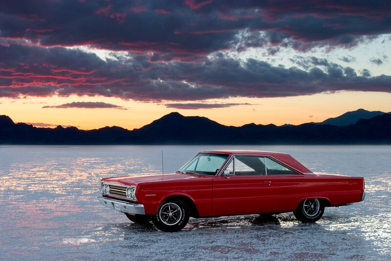 Red muscle car at sunset