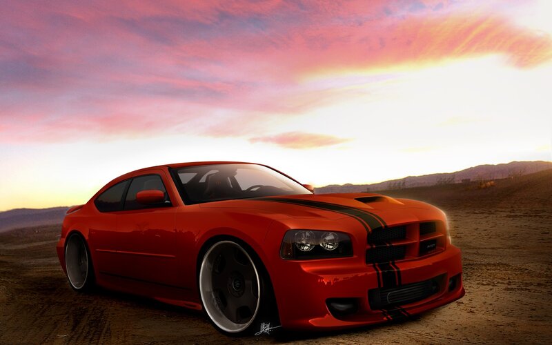 Red muscle car at sunset