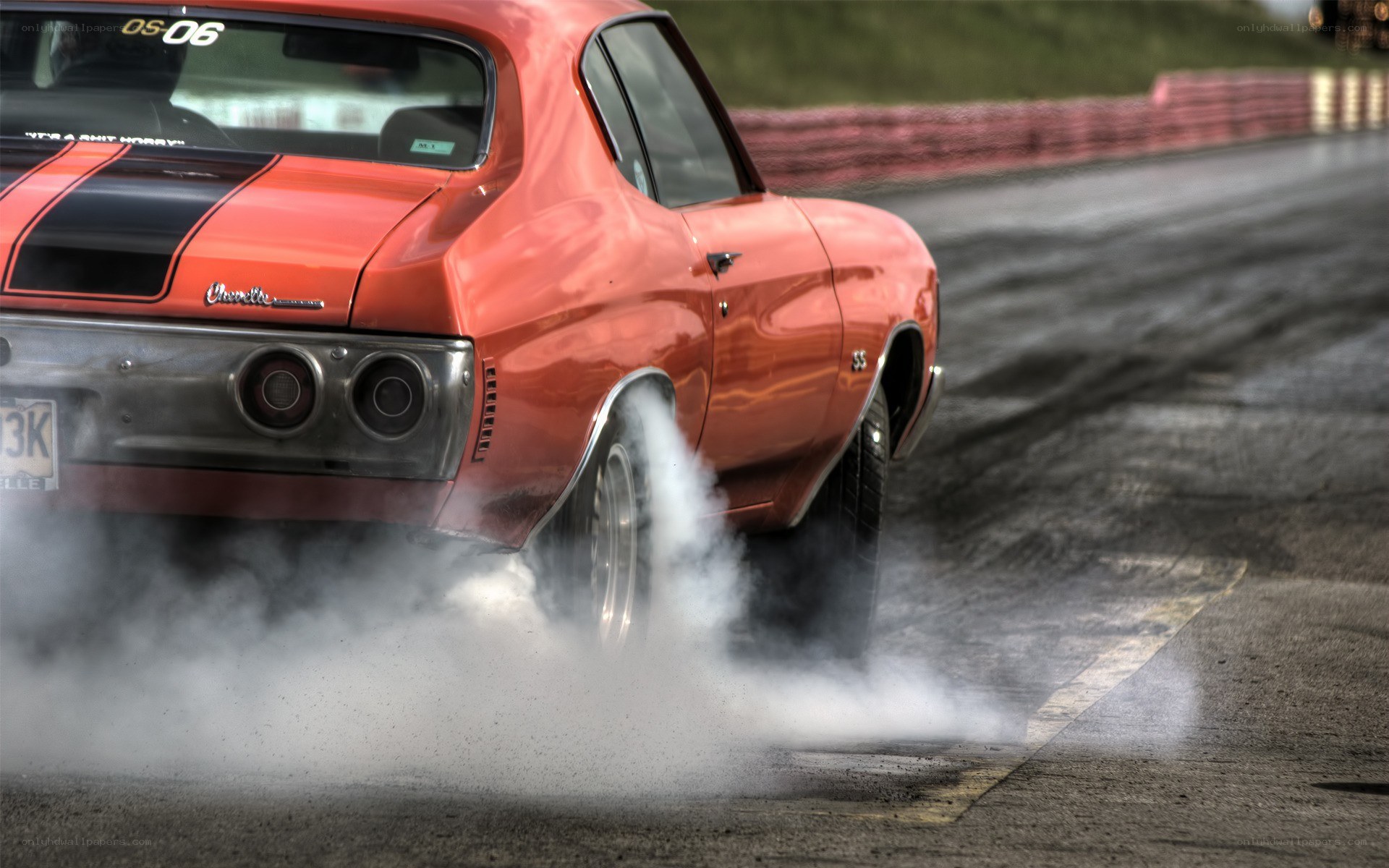Red muscle car burnout