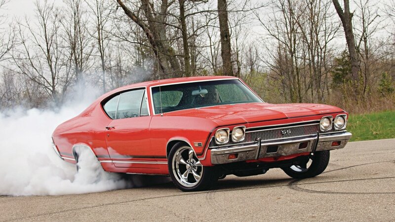 Red muscle car doing burnout