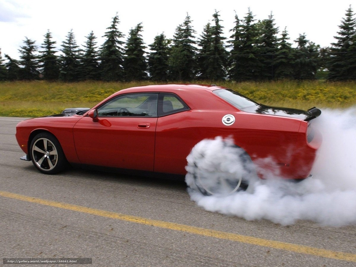 Red muscle car doing burnout