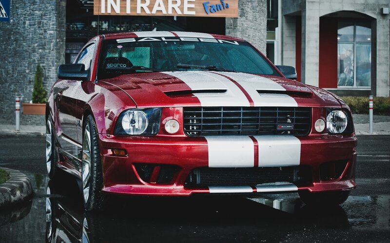 Red Muscle Car — Dramatic, Photograph, Building, Wet Pavement