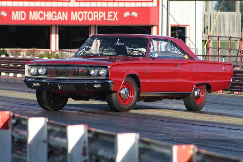 Red Muscle Car — Dynamic, Afternoon, Photograph, Race Track, Building