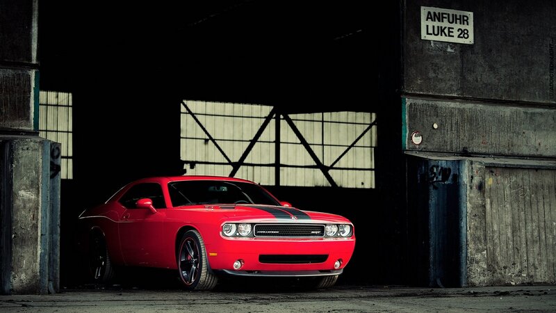 Red muscle car in a warehouse