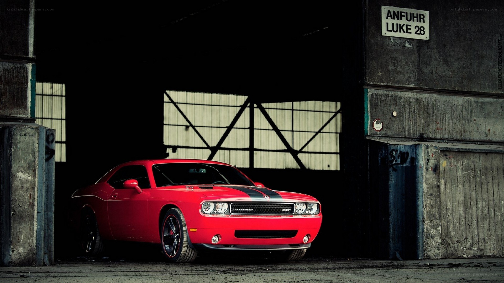 Red muscle car in a warehouse