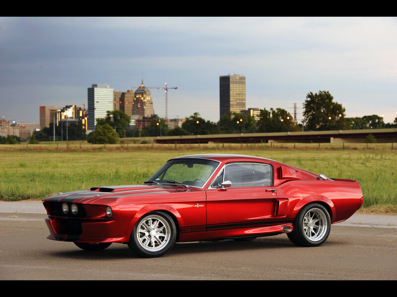 Red muscle car in cityscape