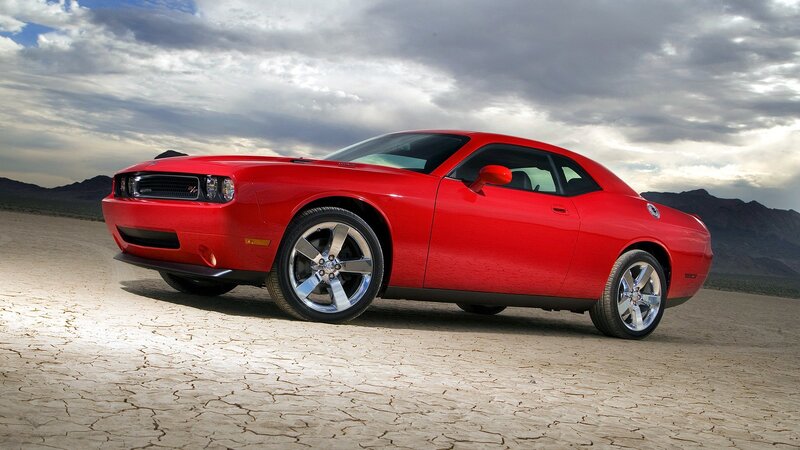 Red muscle car in desert
