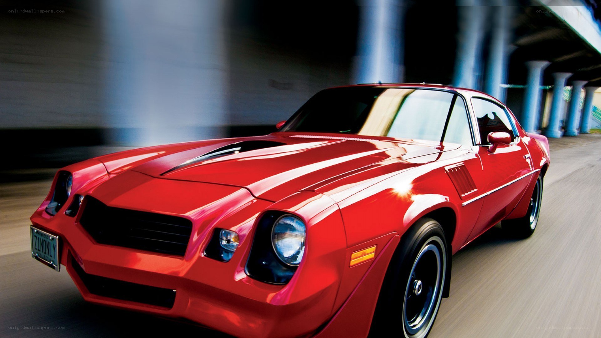 Red muscle car in motion
