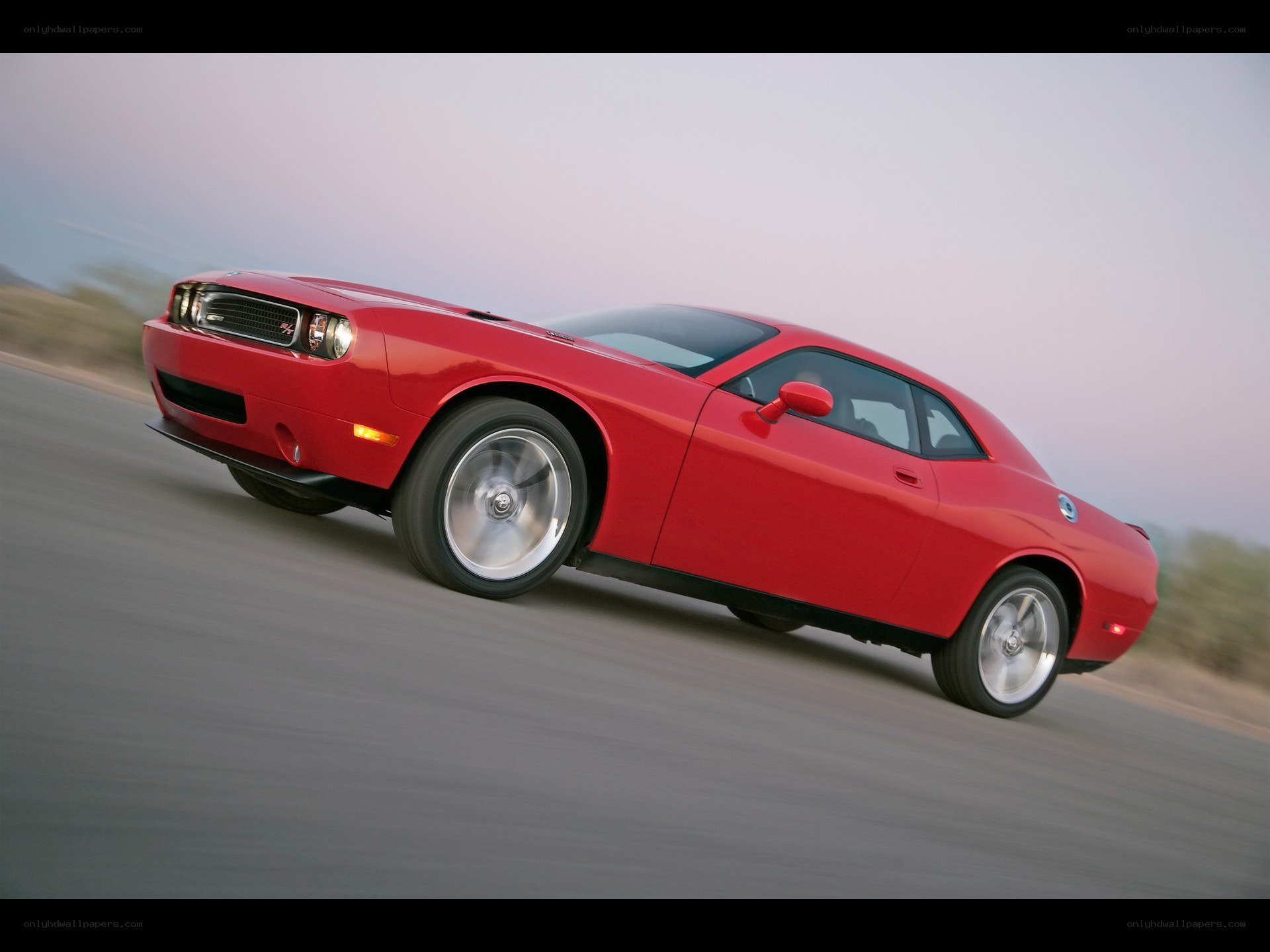 Red muscle car in motion