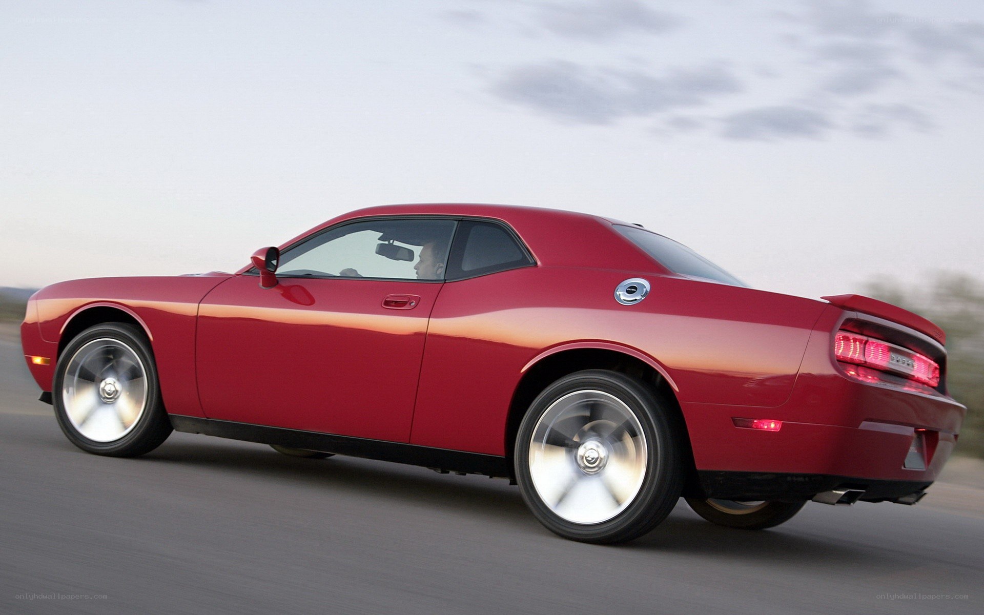 Red muscle car in motion