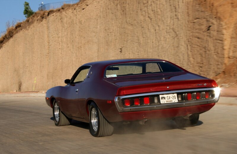 red muscle car in motion