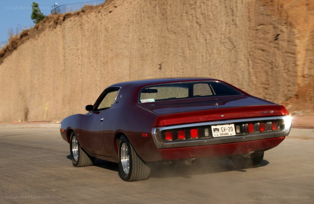 red muscle car in motion