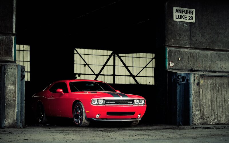 Red muscle car in warehouse