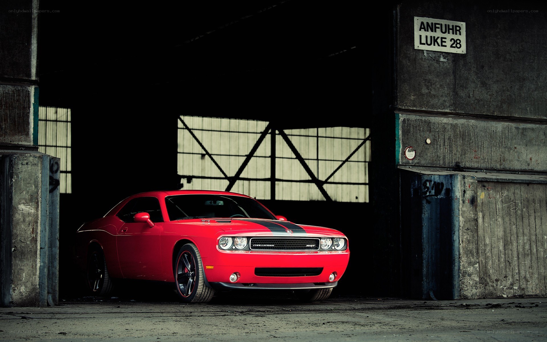Red muscle car in warehouse