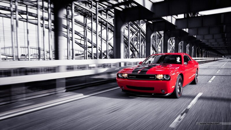 Red muscle car on a bridge