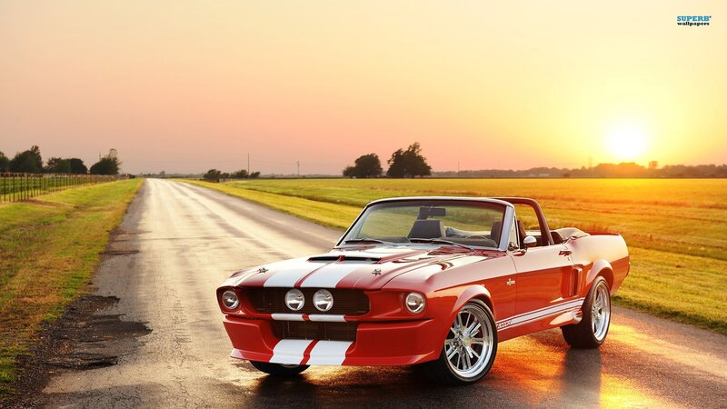 Red muscle car on country road