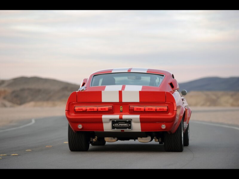 red muscle car on desert road