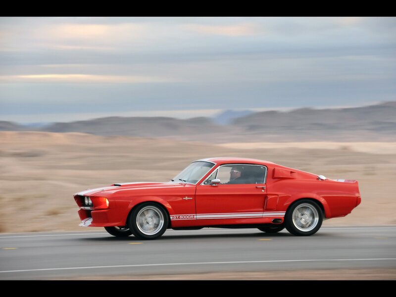Red muscle car on desert road