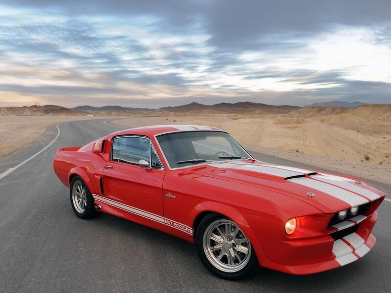 Red muscle car on desert road