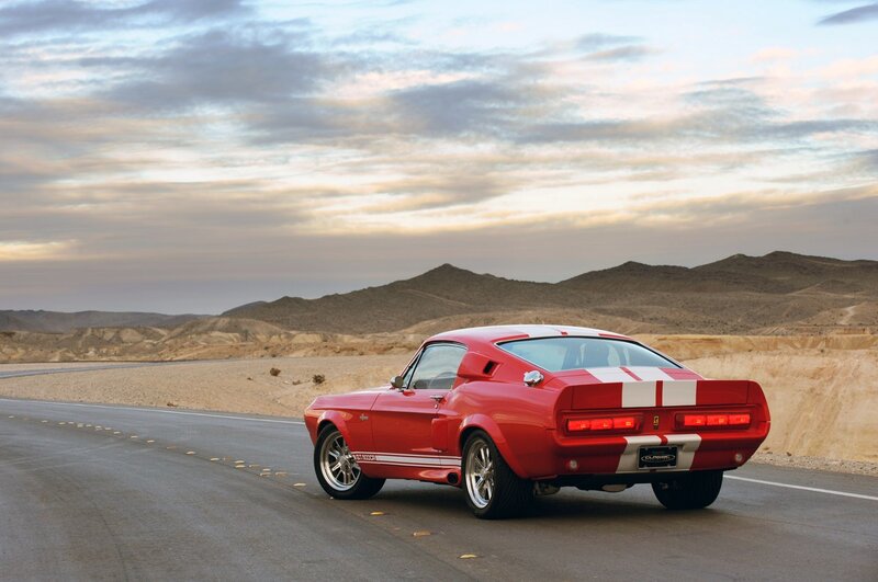 Red muscle car on desert road