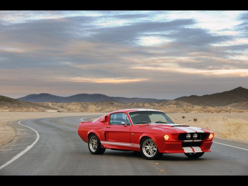 Red muscle car on desert road