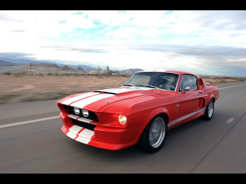 Red muscle car on desert road