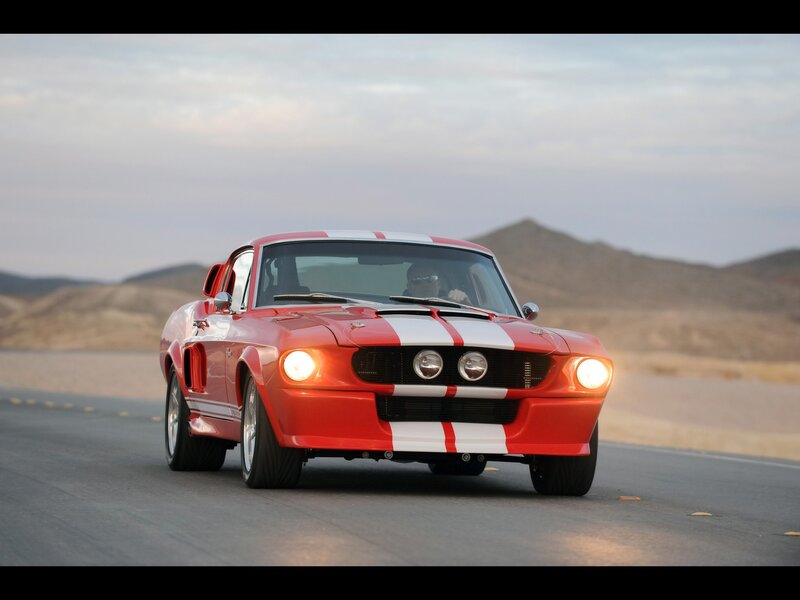 Red muscle car on desert road